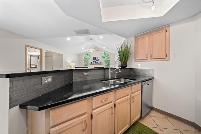 354 Hidden Ravines Dr, Powell, OH 43065 - kitchen featuring stainless steel dishwasher, decorative backsplash, light brown cabinetry, vaulted ceiling, and light tile patterned floors