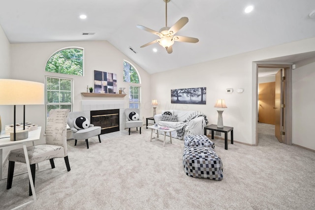 354 Hidden Ravines Dr, Powell, OH 43065 - carpeted living area with lofted ceiling, a ceiling fan, a tiled fireplace, and recessed lighting