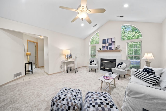 354 Hidden Ravines Dr, Powell, OH 43065 - living area with carpet flooring, ceiling fan, a tile fireplace, high vaulted ceiling, and recessed lighting