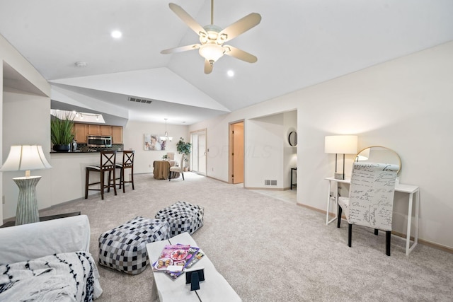354 Hidden Ravines Dr, Powell, OH 43065 - living room featuring vaulted ceiling, ceiling fan, and light carpet