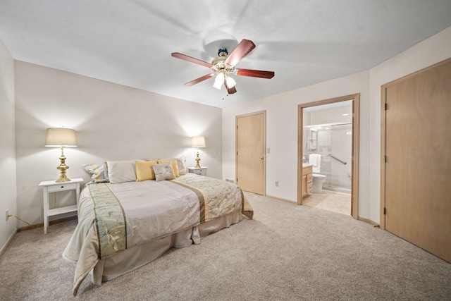 354 Hidden Ravines Dr, Powell, OH 43065 - bedroom featuring light colored carpet, ensuite bathroom, and ceiling fan