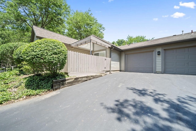 354 Hidden Ravines Dr, Powell, OH 43065 - view of front of home with asphalt driveway and an attached garage