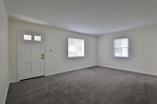 815 Eddystone Ave, Columbus, OH 43224 - entrance foyer with dark carpet and baseboards