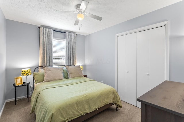 11962 Joppa Rd, Logan, OH 43138 - bedroom with light carpet, a closet, a textured ceiling, and a ceiling fan