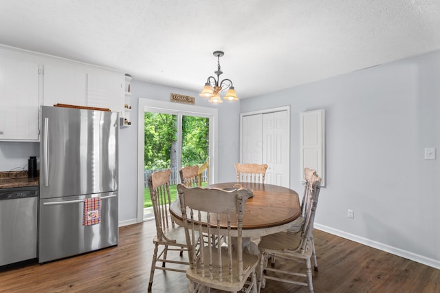11962 Joppa Rd, Logan, OH 43138 - dining space with a chandelier and dark wood finished floors
