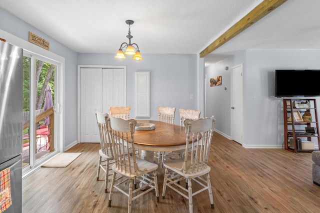 11962 Joppa Rd, Logan, OH 43138 - dining room with wood finished floors and a chandelier