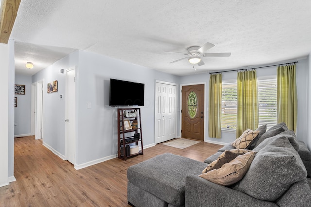 11962 Joppa Rd, Logan, OH 43138 - living room with a textured ceiling, wood finished floors, and ceiling fan
