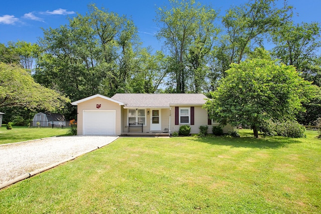 11962 Joppa Rd, Logan, OH 43138 - view of front of house featuring gravel driveway, an attached garage, a front yard, and covered porch