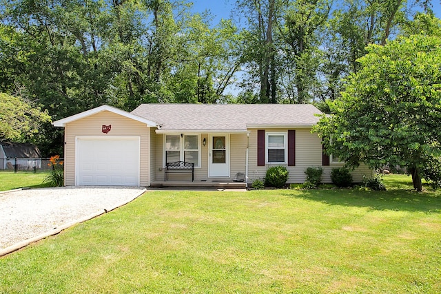 11962 Joppa Rd, Logan, OH 43138 - ranch-style house featuring driveway, an attached garage, a porch, a front lawn, and roof with shingles