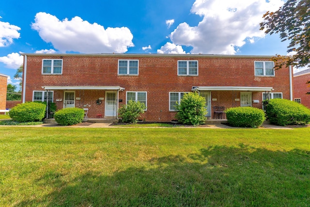 2043 Ridgeview Rd, Columbus, OH 43221 - townhome / multi-family property featuring a front yard and brick siding