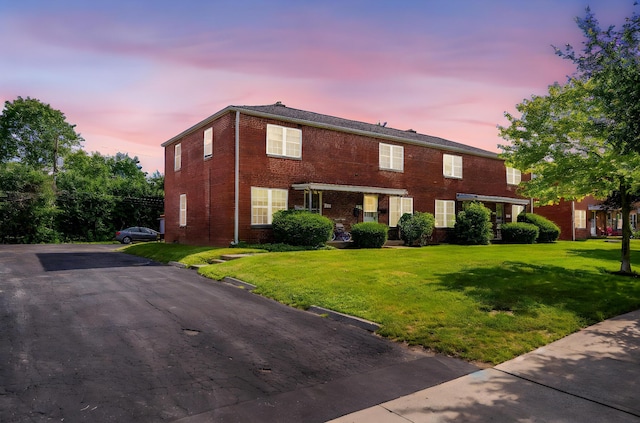 2043 Ridgeview Rd, Columbus, OH 43221 - view of front facade with brick siding and a front lawn