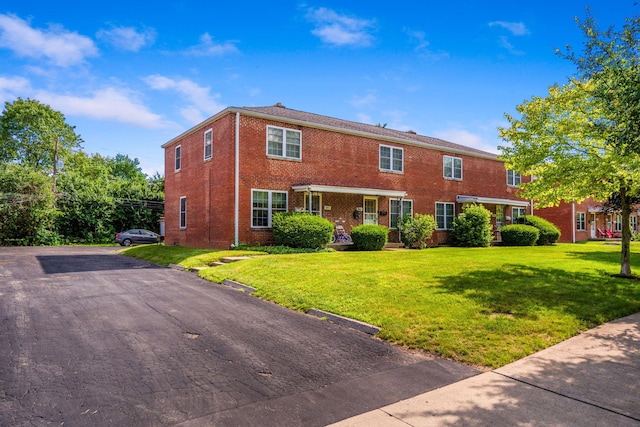2043 Ridgeview Rd, Columbus, OH 43221 - view of front of home with brick siding and a front yard