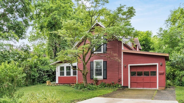 339 W Maple St, Granville, OH 43023 - view of home's exterior featuring driveway, a yard, and a garage