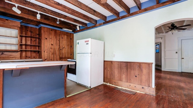 339 W Maple St, Granville, OH 43023 - kitchen featuring white appliances, track lighting, arched walkways, a ceiling fan, and wood walls