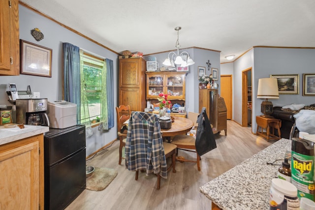 22139 Sams Creek Rd, Laurelville, OH 43135 - dining area with a chandelier, ornamental molding, and light wood-type flooring
