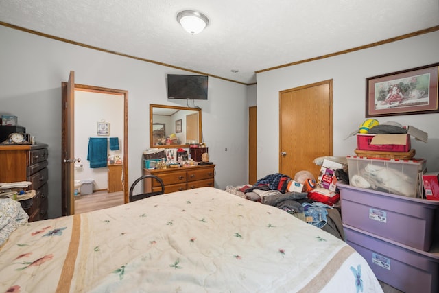 22139 Sams Creek Rd, Laurelville, OH 43135 - bedroom featuring crown molding, wood finished floors, and a textured ceiling
