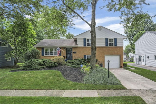 4861 Dickens Dr, Columbus, OH 43227 - split level home with brick siding, concrete driveway, a garage, and a front lawn