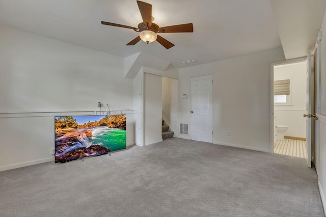 4861 Dickens Dr, Columbus, OH 43227 - unfurnished living room with a ceiling fan, carpet floors, and stairs