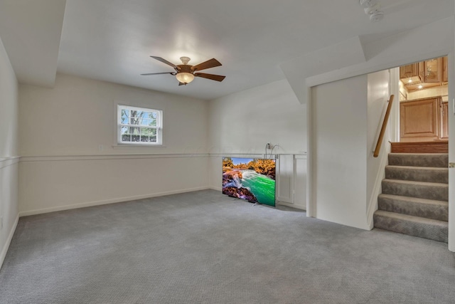 4861 Dickens Dr, Columbus, OH 43227 - below grade area with carpet floors, a ceiling fan, and stairway