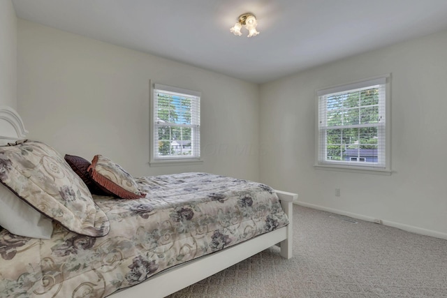 4861 Dickens Dr, Columbus, OH 43227 - carpeted bedroom featuring multiple windows