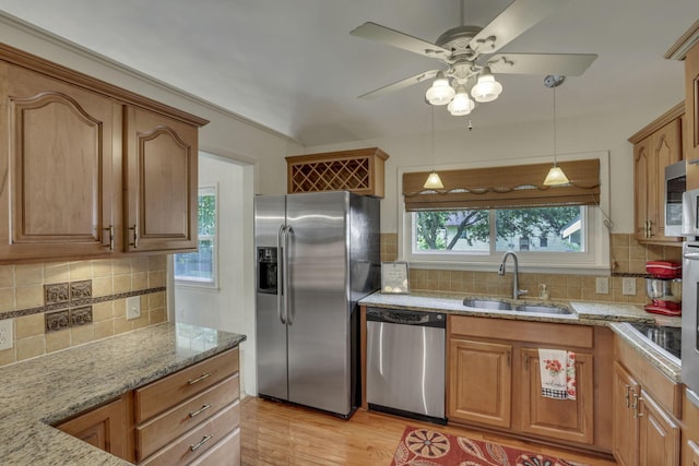 4861 Dickens Dr, Columbus, OH 43227 - kitchen featuring stainless steel appliances, decorative backsplash, light stone countertops, and ceiling fan