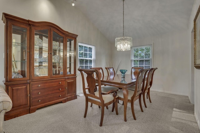 4861 Dickens Dr, Columbus, OH 43227 - dining room featuring light colored carpet, a chandelier, and vaulted ceiling