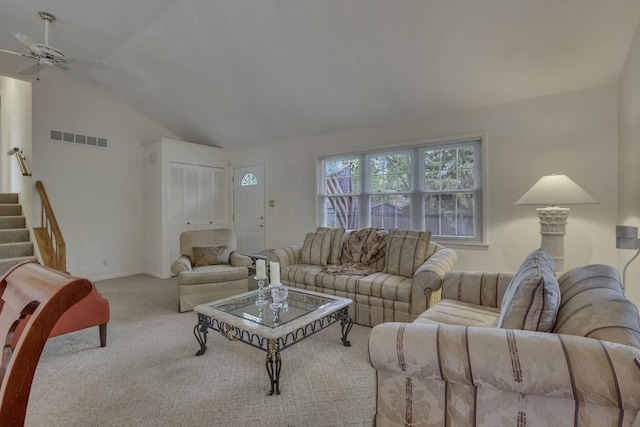 4861 Dickens Dr, Columbus, OH 43227 - carpeted living room with ceiling fan, lofted ceiling, and stairway