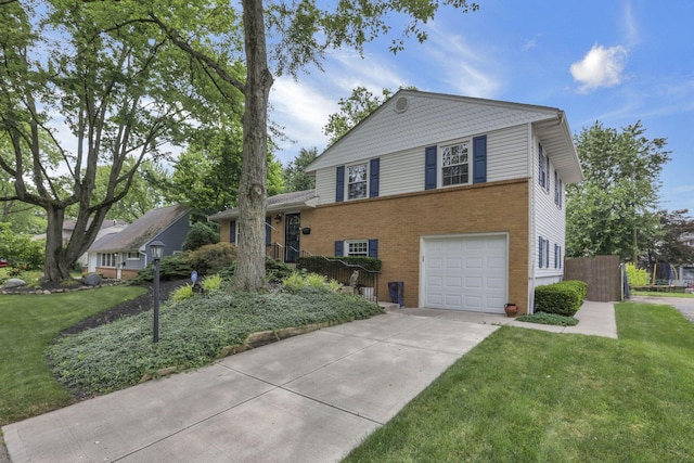 4861 Dickens Dr, Columbus, OH 43227 - tri-level home featuring brick siding, driveway, and an attached garage
