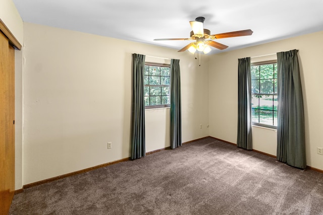 6983 Doran Dr, New Albany, OH 43054 - empty room featuring plenty of natural light, carpet flooring, and ceiling fan