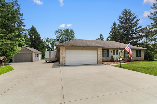 6983 Doran Dr, New Albany, OH 43054 - ranch-style house with brick siding, a chimney, a front lawn, and an outbuilding