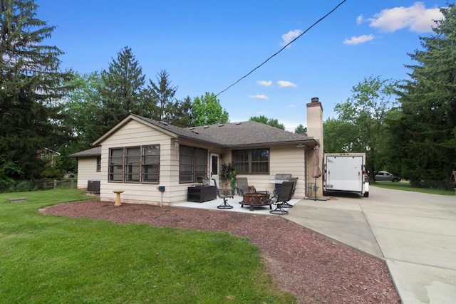 6983 Doran Dr, New Albany, OH 43054 - rear view of property featuring an outdoor fire pit, a yard, a chimney, and a patio area