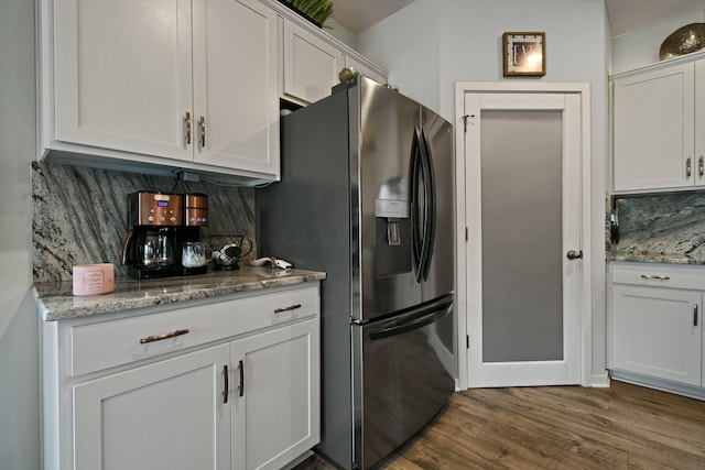 152 Natalie Ln, Granville, OH 43023 - kitchen featuring refrigerator with ice dispenser, tasteful backsplash, dark wood-type flooring, and white cabinets