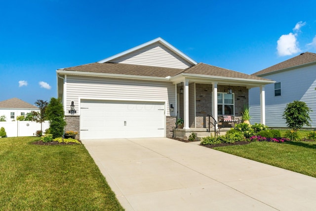 152 Natalie Ln, Granville, OH 43023 - ranch-style home featuring covered porch, a garage, stone siding, driveway, and roof with shingles