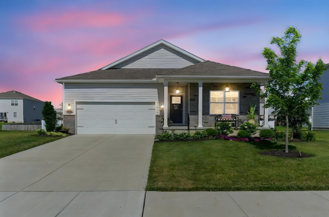 152 Natalie Ln, Granville, OH 43023 - single story home featuring a lawn, concrete driveway, an attached garage, and a porch