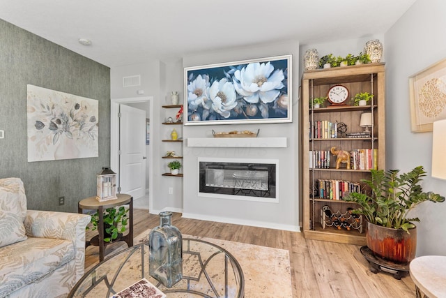 152 Natalie Ln, Granville, OH 43023 - living room featuring wood finished floors and a glass covered fireplace