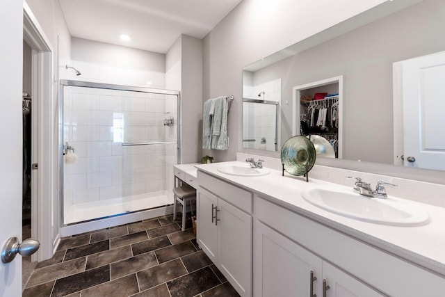 152 Natalie Ln, Granville, OH 43023 - bathroom with a stall shower, a spacious closet, and double vanity