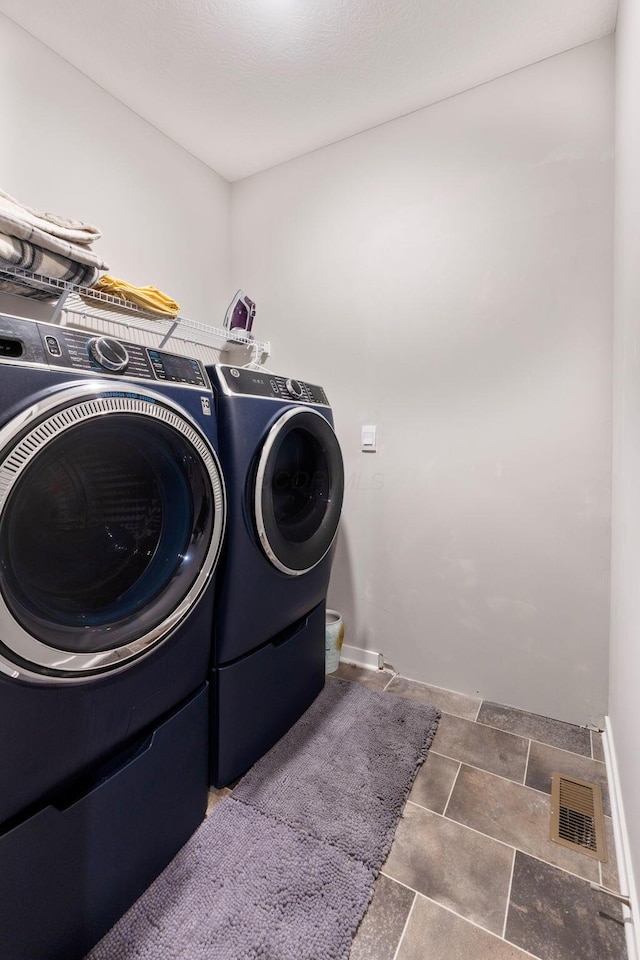 152 Natalie Ln, Granville, OH 43023 - washroom featuring washing machine and dryer and baseboards