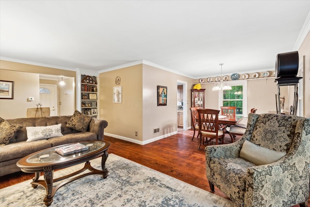 445 Hilltop Dr, Lancaster, OH 43130 - living room featuring wood finished floors, ornamental molding, and a chandelier