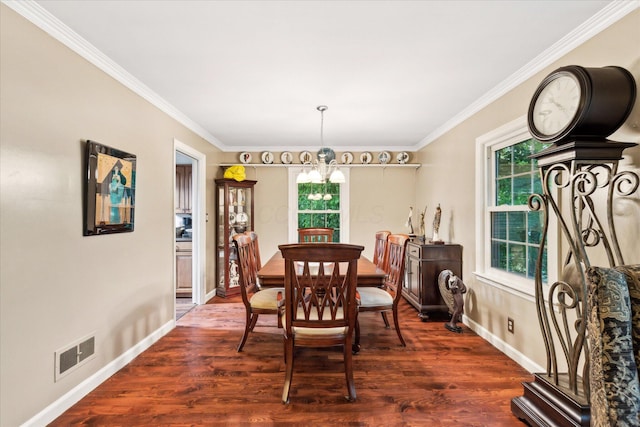 445 Hilltop Dr, Lancaster, OH 43130 - dining space with a chandelier, plenty of natural light, ornamental molding, and dark wood-style flooring