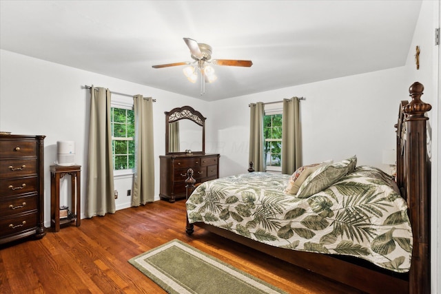 445 Hilltop Dr, Lancaster, OH 43130 - bedroom featuring dark wood-style flooring, multiple windows, and ceiling fan