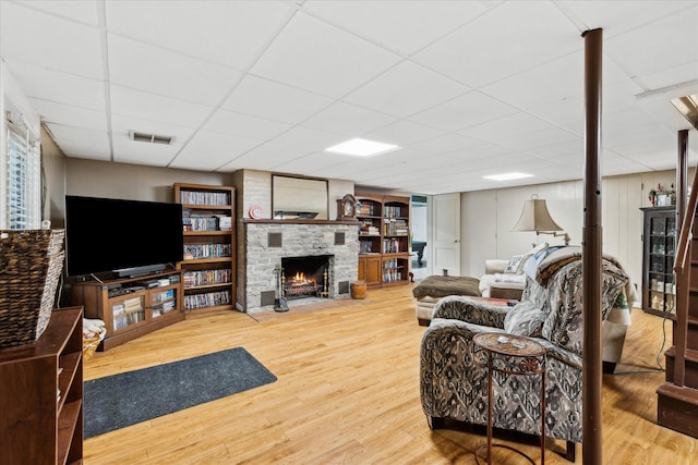 445 Hilltop Dr, Lancaster, OH 43130 - living area featuring a large fireplace, wood finished floors, and a drop ceiling