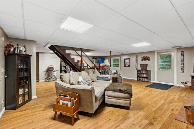 445 Hilltop Dr, Lancaster, OH 43130 - living area featuring stairs, light wood-style floors, and a drop ceiling