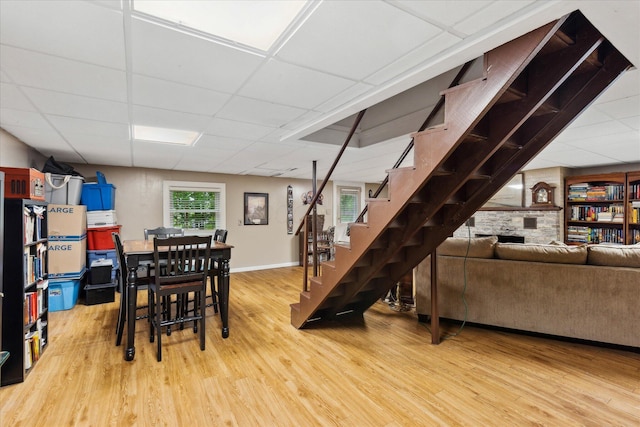 445 Hilltop Dr, Lancaster, OH 43130 - dining space featuring a drop ceiling, light wood-style flooring, and stairway