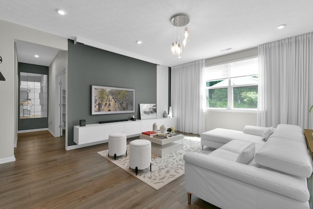 1180 Lake Forest Dr, Hebron, OH 43025 - living room featuring wood finished floors, recessed lighting, and a chandelier