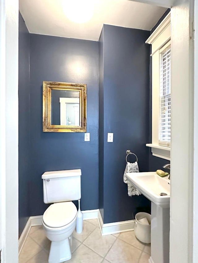252 W Hubbard Ave, Columbus, OH 43215 - half bathroom with toilet and tile patterned flooring