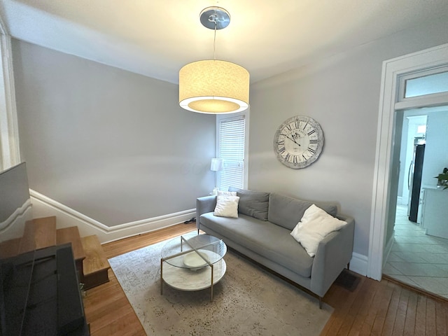 252 W Hubbard Ave, Columbus, OH 43215 - living room with hardwood / wood-style flooring and healthy amount of natural light
