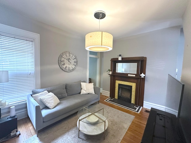 252 W Hubbard Ave, Columbus, OH 43215 - living room featuring wood finished floors and a fireplace