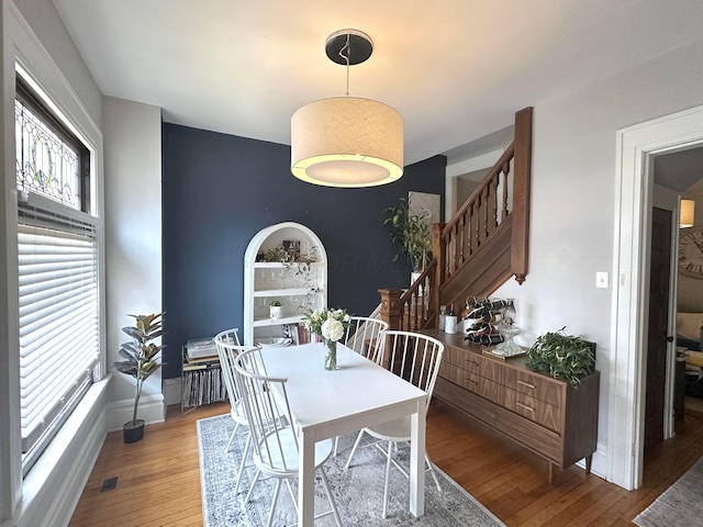 252 W Hubbard Ave, Columbus, OH 43215 - dining space with wood-type flooring and stairway
