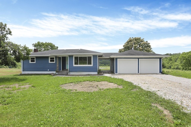 39703 Maysville Greendale Rd, Logan, OH 43138 - single story home with a front lawn, a chimney, and a detached garage