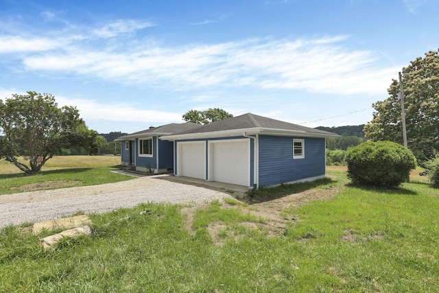 39703 Maysville Greendale Rd, Logan, OH 43138 - view of front of home with driveway, a garage, and a front lawn